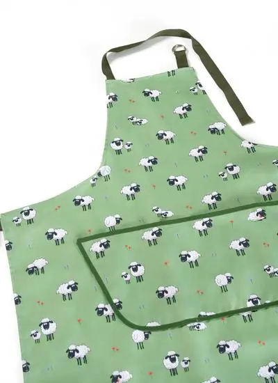 green apron with sheep motif on  white background
