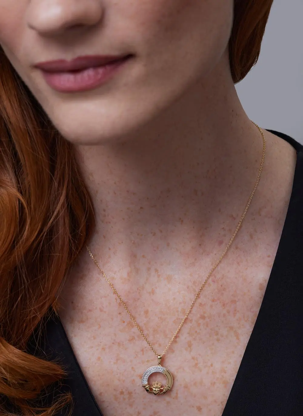 Close up of red haired model wearing 14ct Gold 