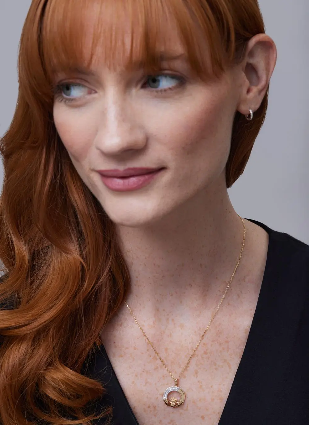 Red haired model wearing 14ct Gold 