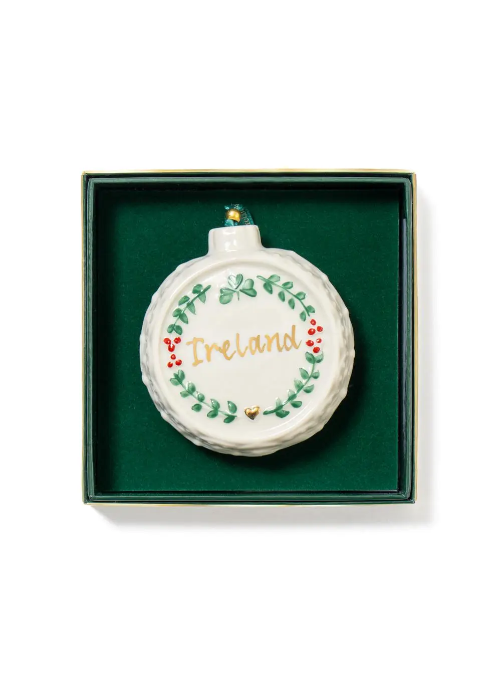 A round, ireland-themed christmas ornament featuring the word 