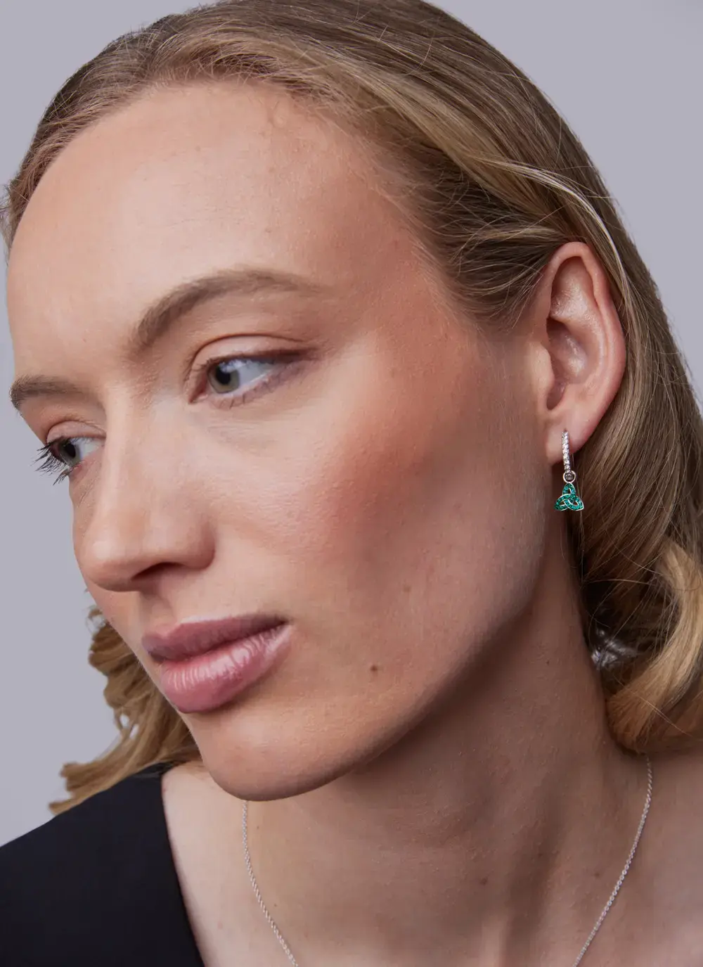 Sterling Silver Trinity Knot Drop Earrings With Sparkling Green Crystals and Clear Crystal Rings