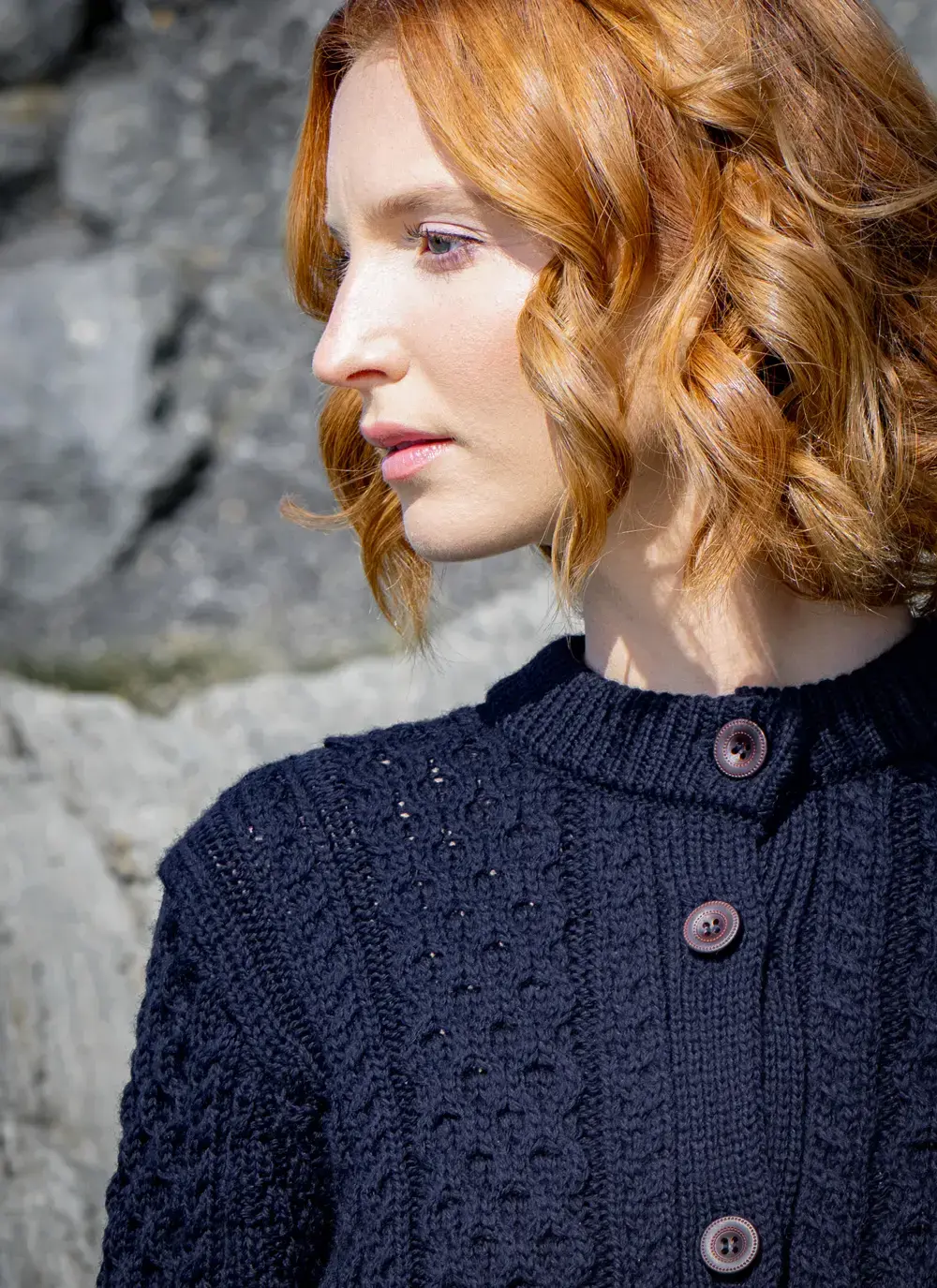 Close up of red head model collar detail buttons 
