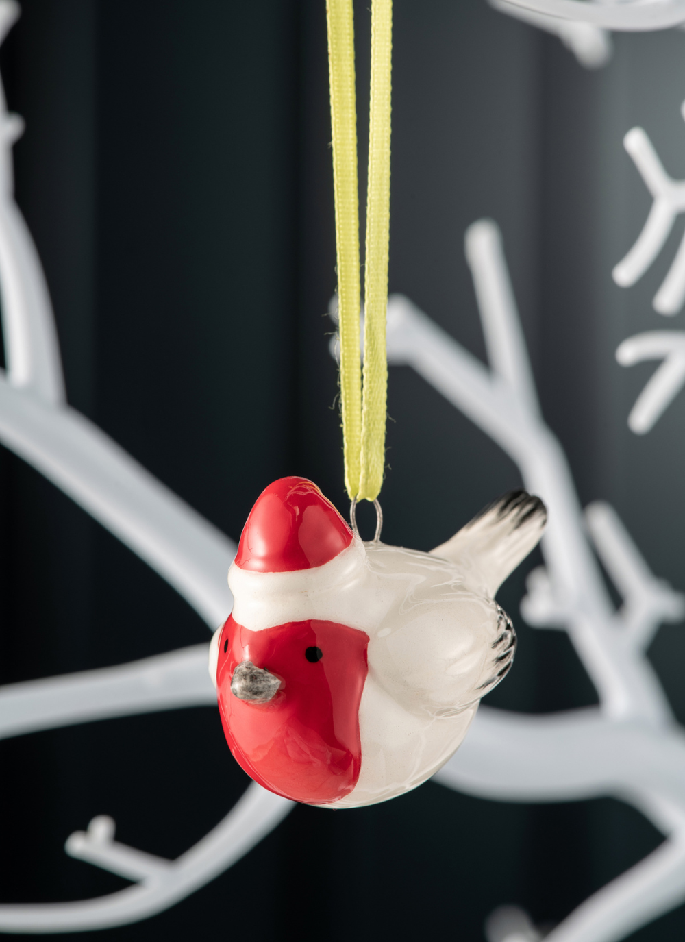 Robin ornament wearing a red santa hat