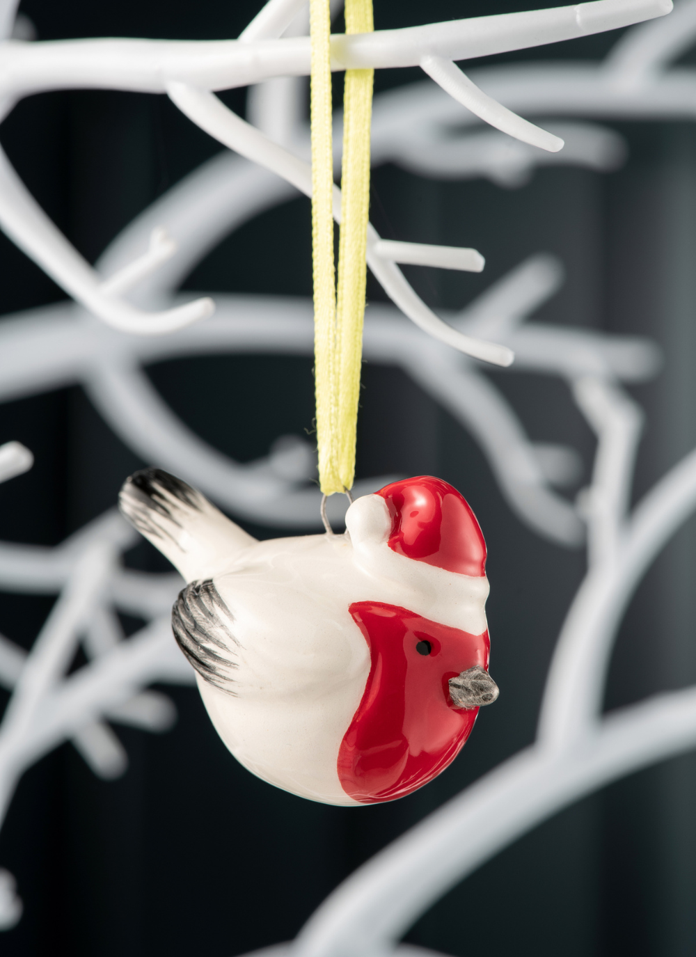 Robin ornament wearing a red santa hat