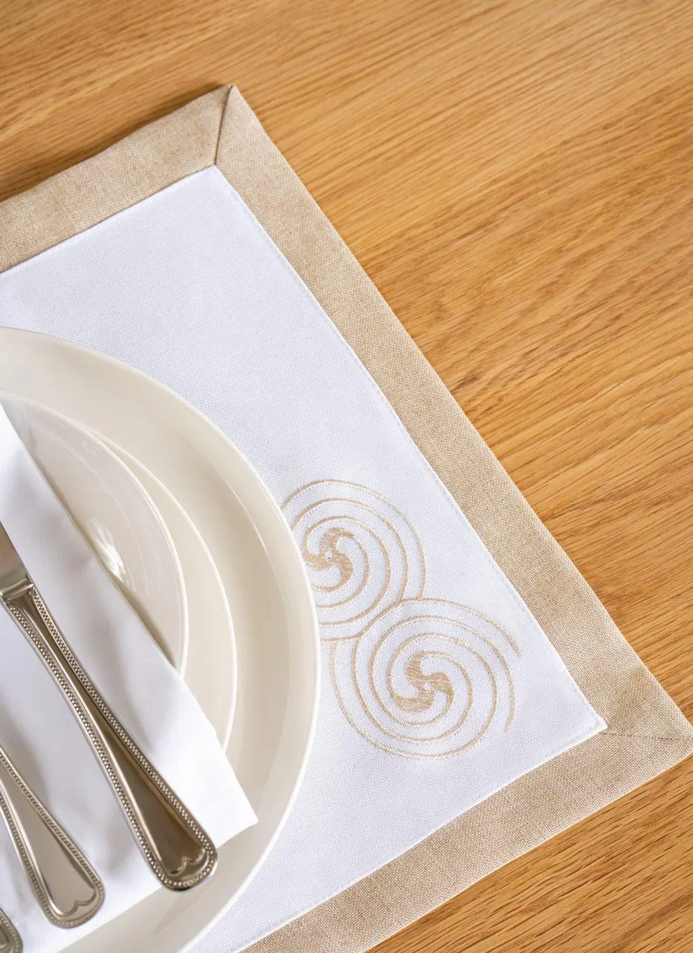styled placemat on table with decorations in detail stiching
