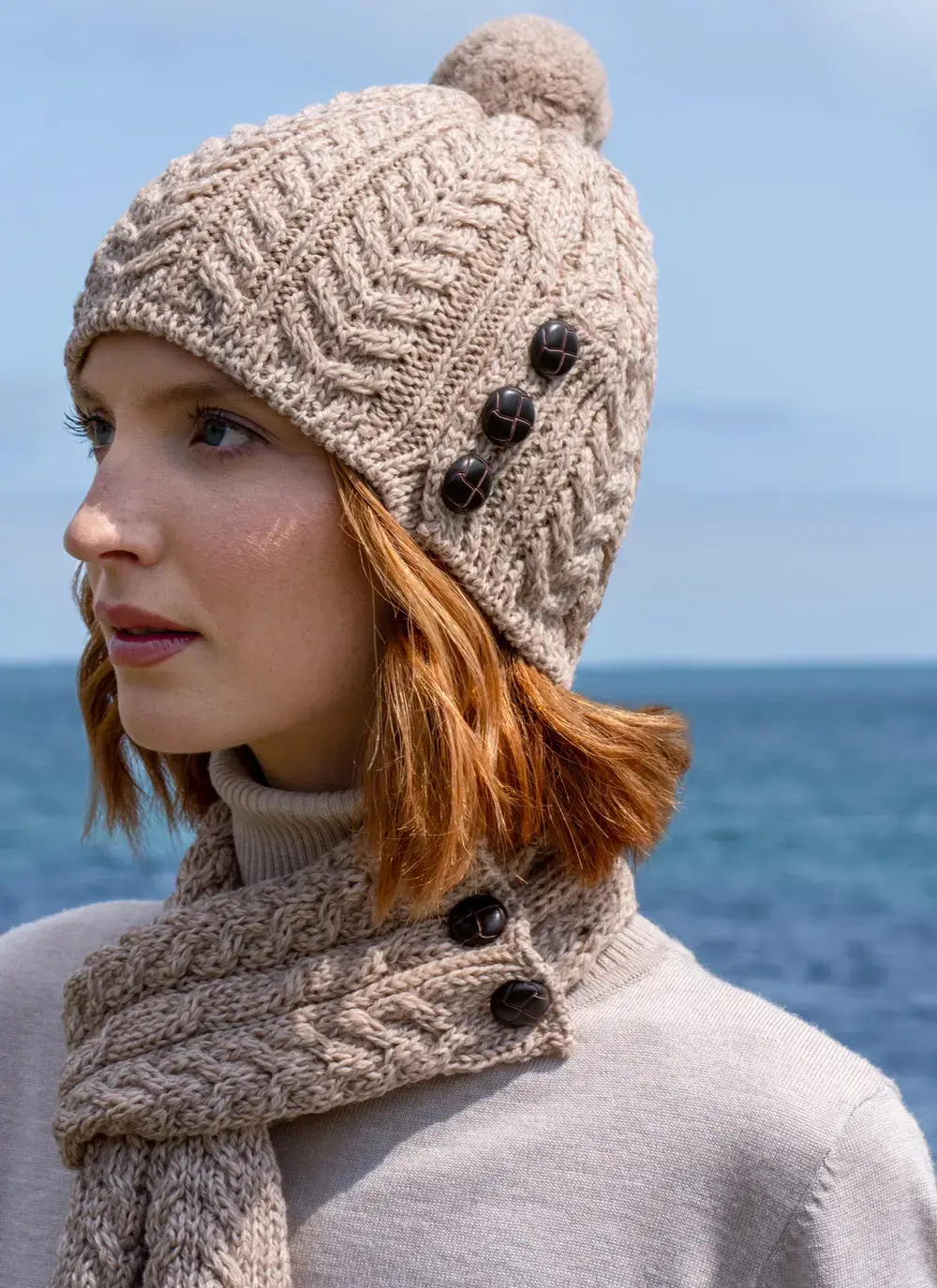 Merino Aran Button Pom Pom Hat in Wicker traditional cable knit