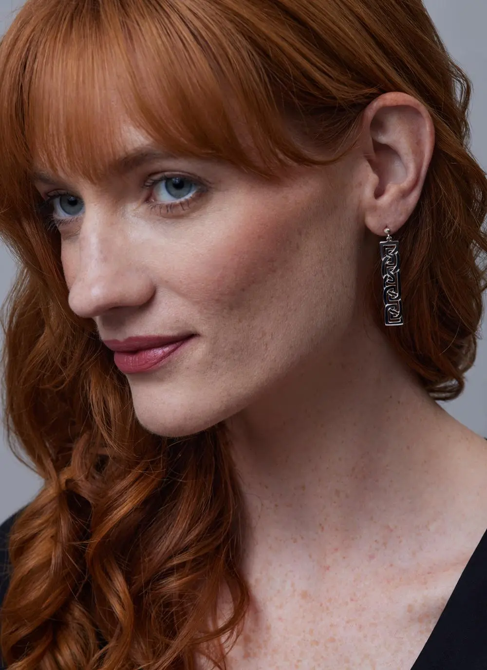 Red haired model wearing Sterling Silver Contemporary Celtic Drop Earrings