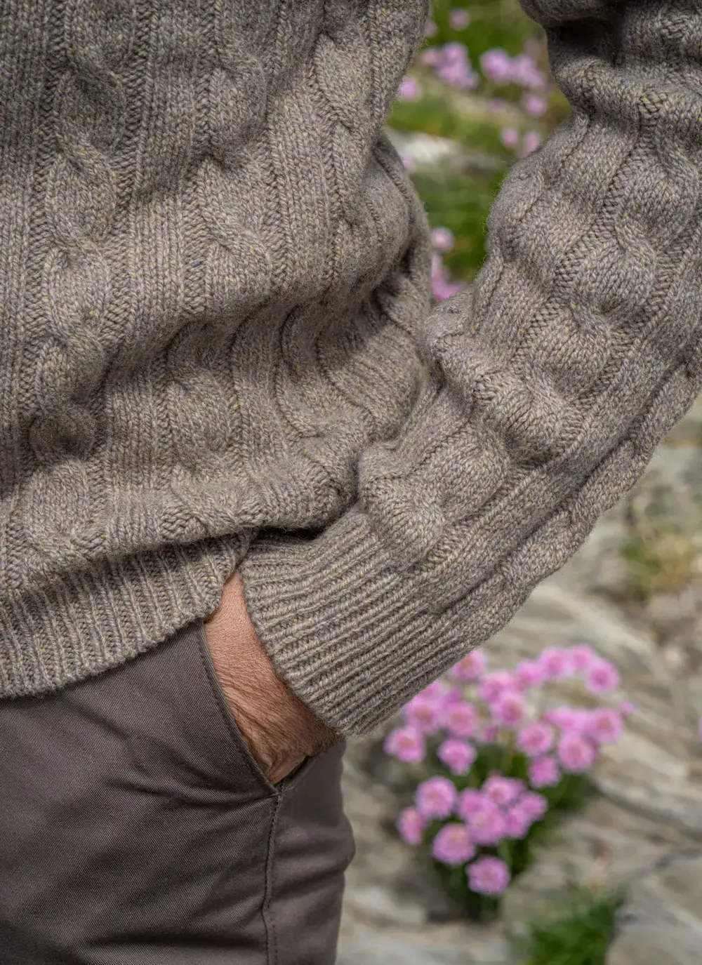 Close-up detail of cable knit texture and soft cashmere wool blend of the Fisherman Sweater in Clay.