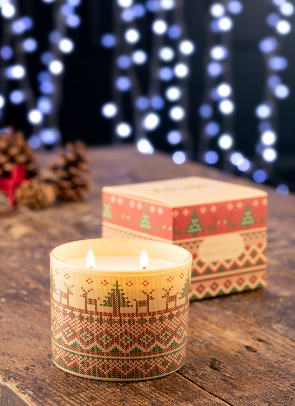 Christmas jumper style printed candle, reindeer and christmas tree printed around the top