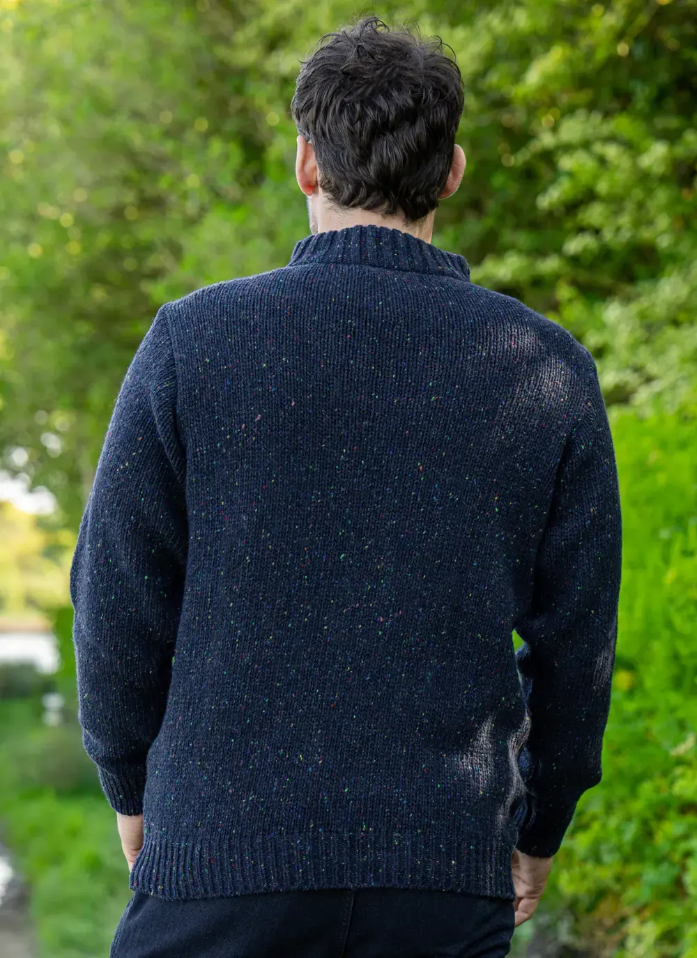 Man wearing navy Glenstone Contrast half zip sweater walking on nature path