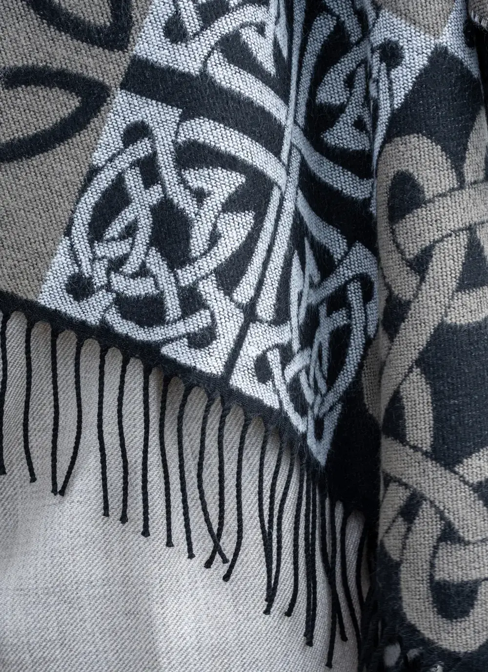 detail of black celtic knot shawl fringe 