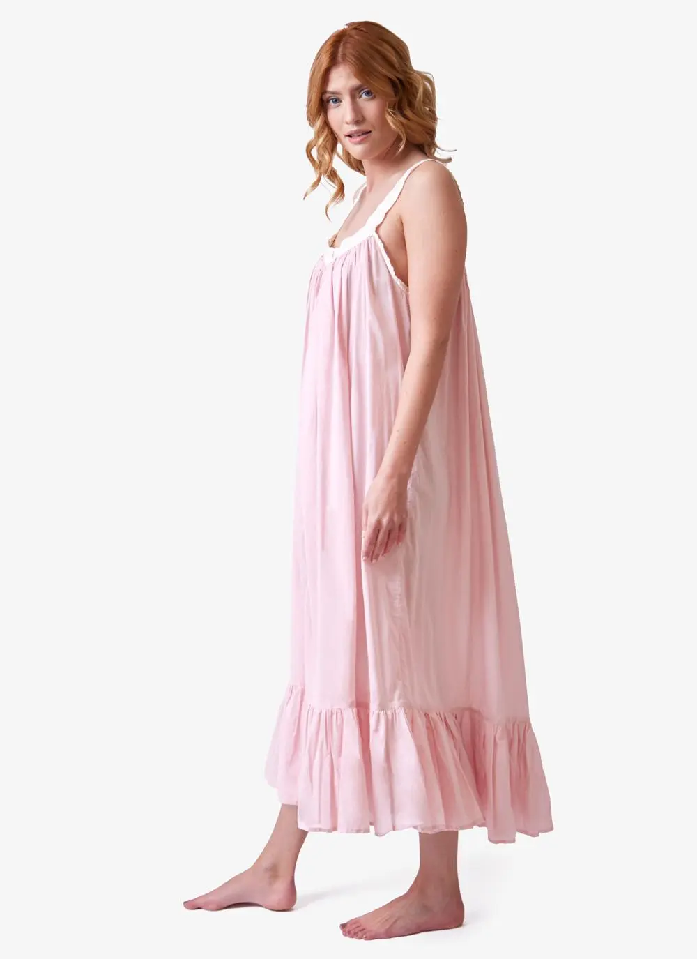Red haired model wearing pink cotton nightdress