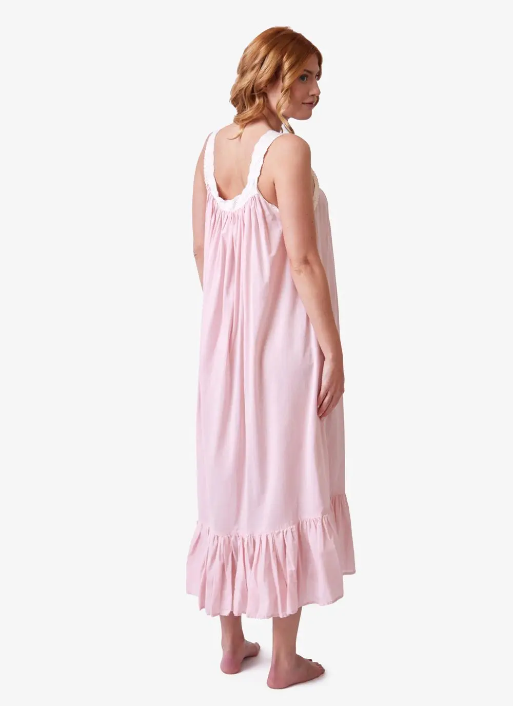 Red haired model wearing pink cotton nightdress