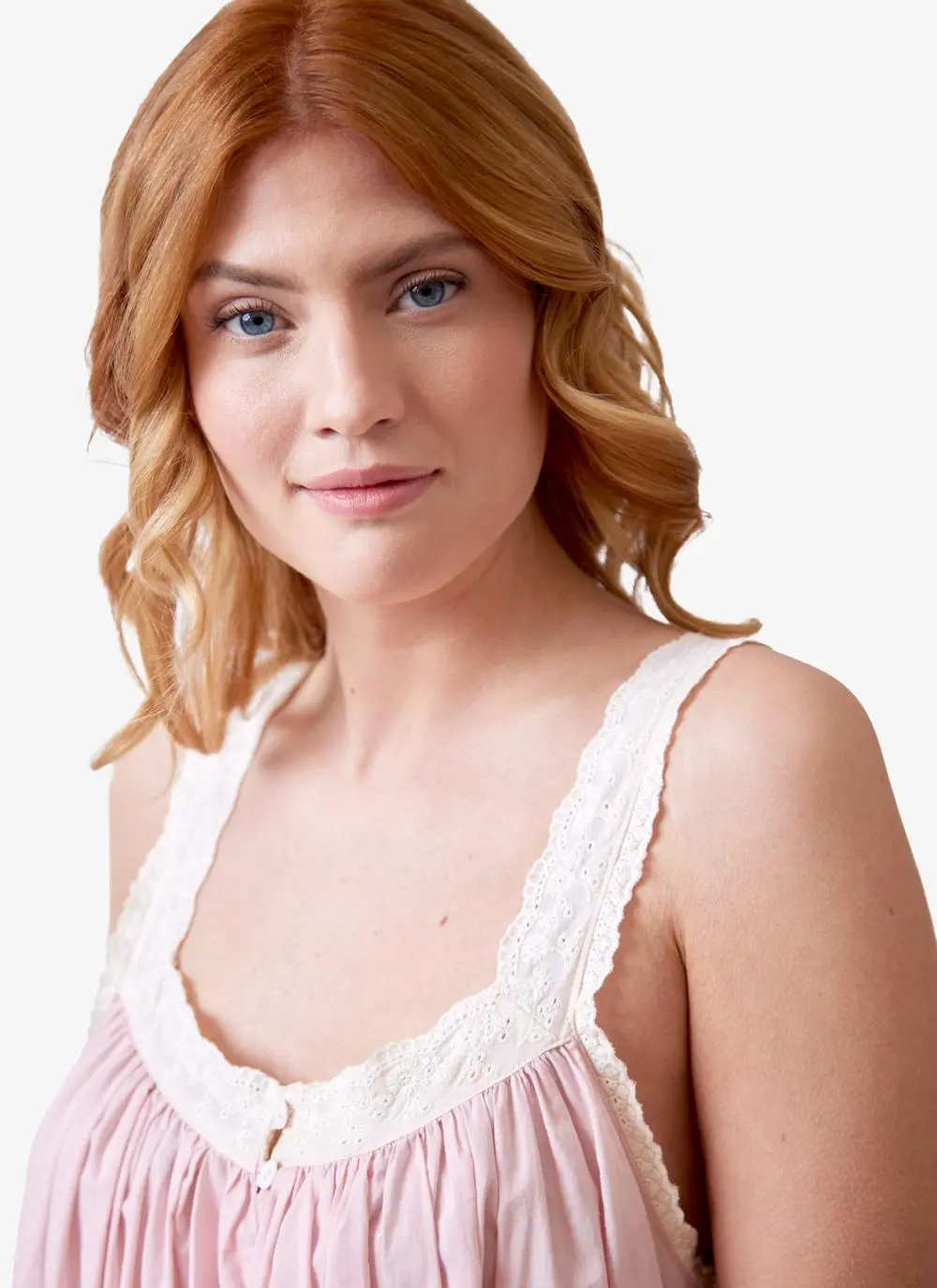 Red haired model wearing pink cotton nightdress