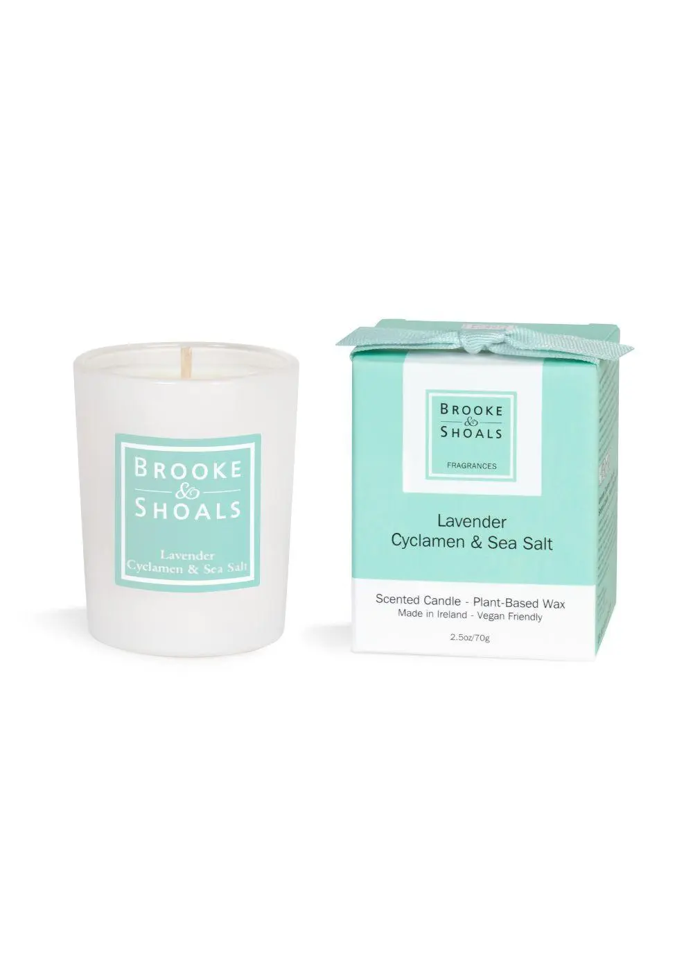 candle and packaging on white background