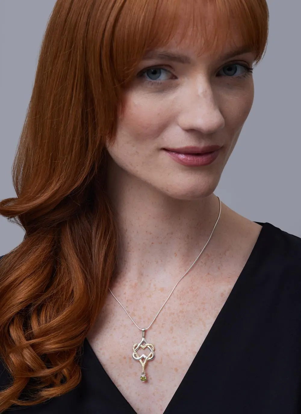 Red haired model wearing Mo Chroi Love Pendant