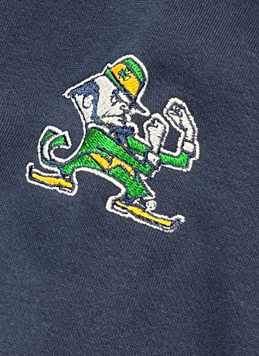 Hoodie with green torso, navy sleeves and hood, Ireland printed in the middle with fighting Irish logo