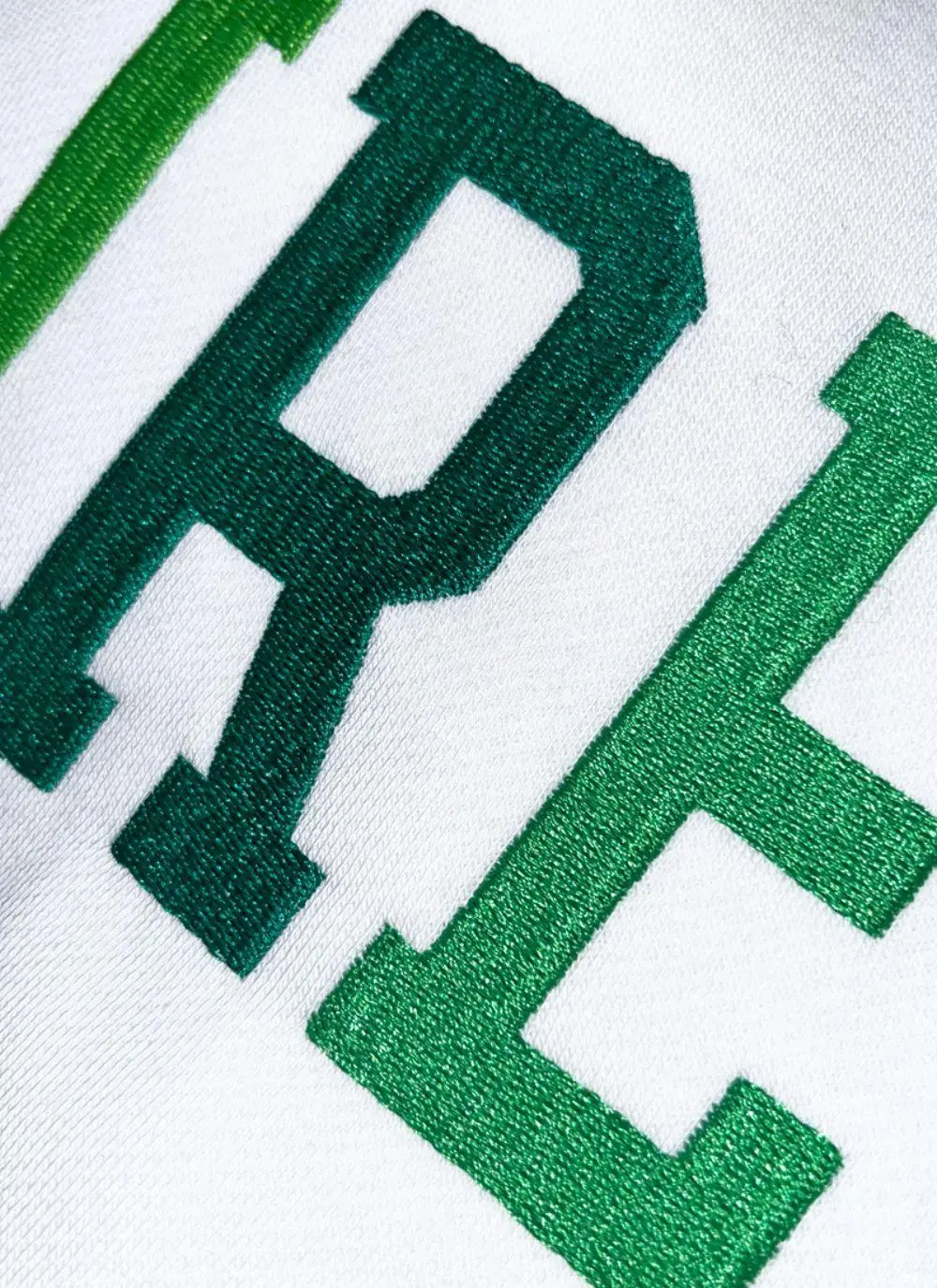 Cream hoodie with Ireland and the fighting Irish logo printed in the middle