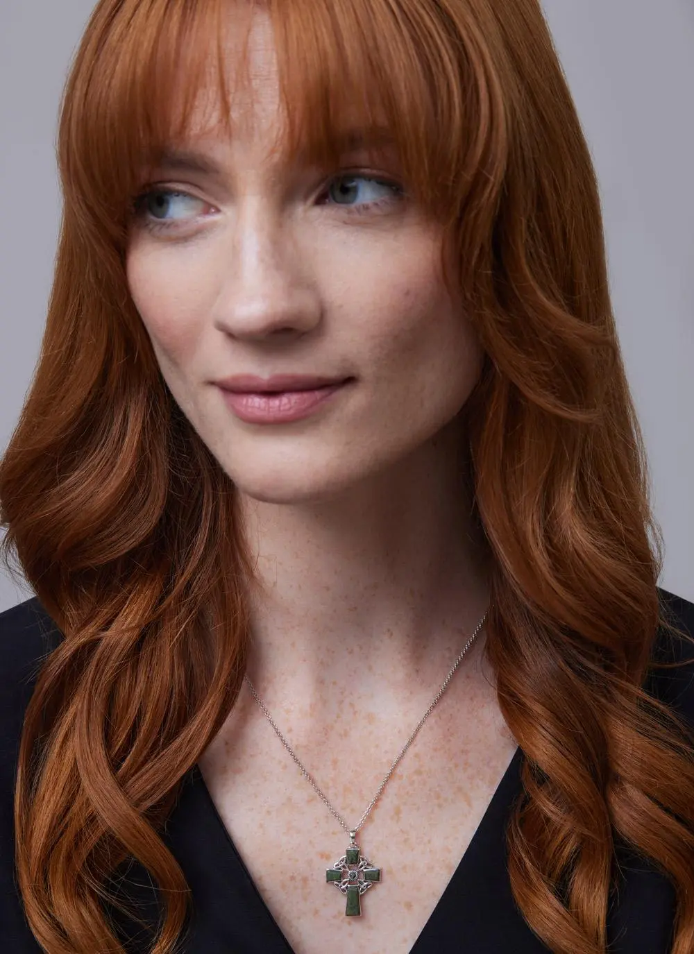 Red haired model wearing Sterling Silver Connemara Marble Celtic Cross Pendant