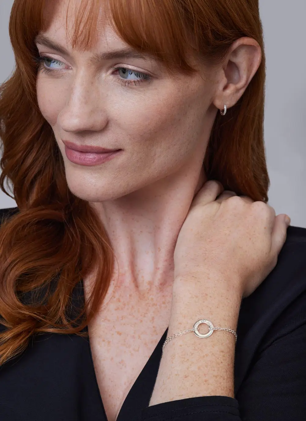 Red haired model wearing Sterling Silver Croi Alainn Bracelet 