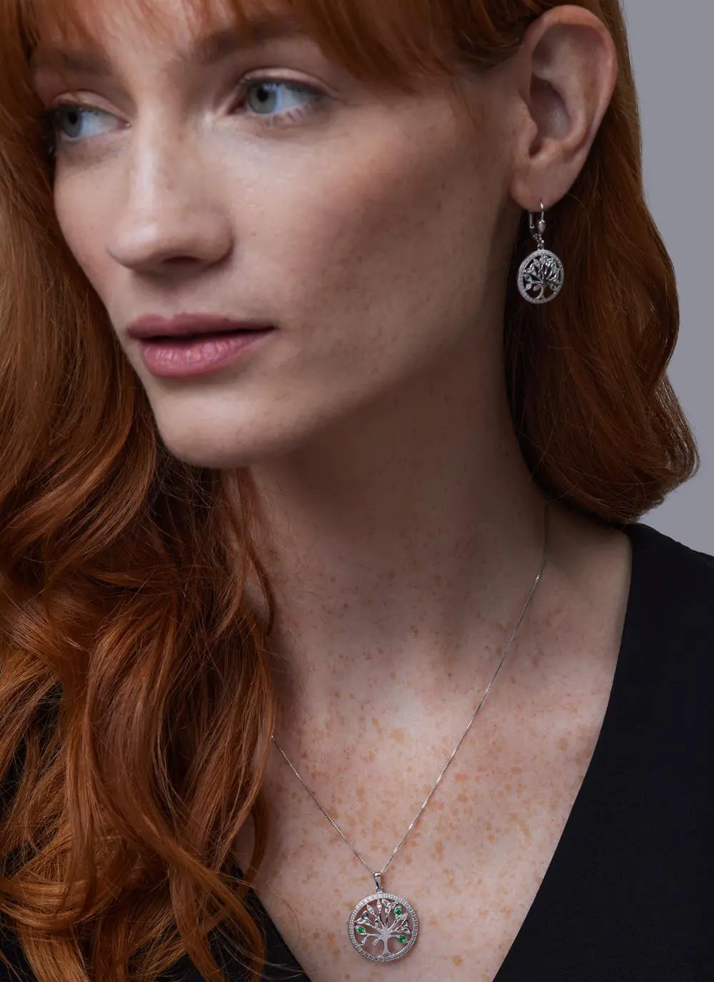 Red haired model wearing Sterling Silver Crystal Illusion Tree of Life Earrings with matching pendant