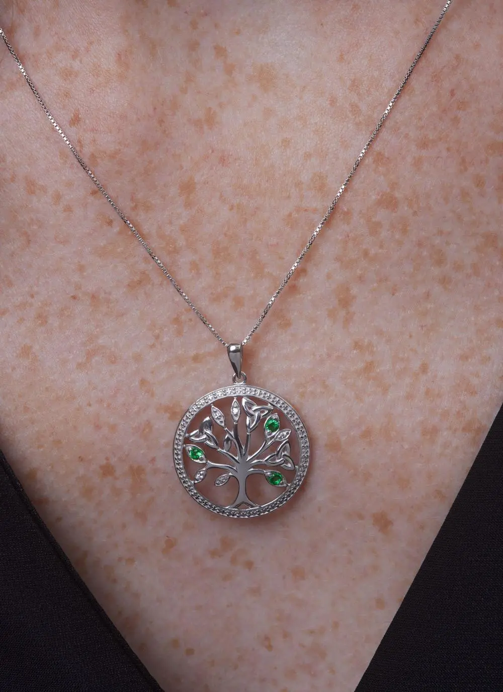 Décolletage shot of Sterling Silver Crystal Illusion Tree of Life Pendant