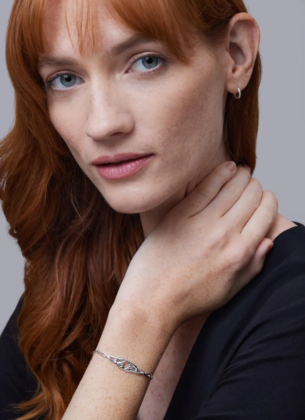 Red haired model wearing Sterling Silver Double Trinity Knot Drawstring Bracelet