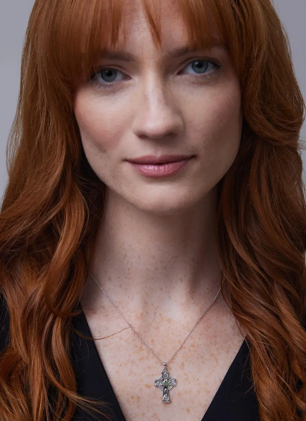 Red haired model wearing Sterling Silver Emerald Celtic Cross Pendant