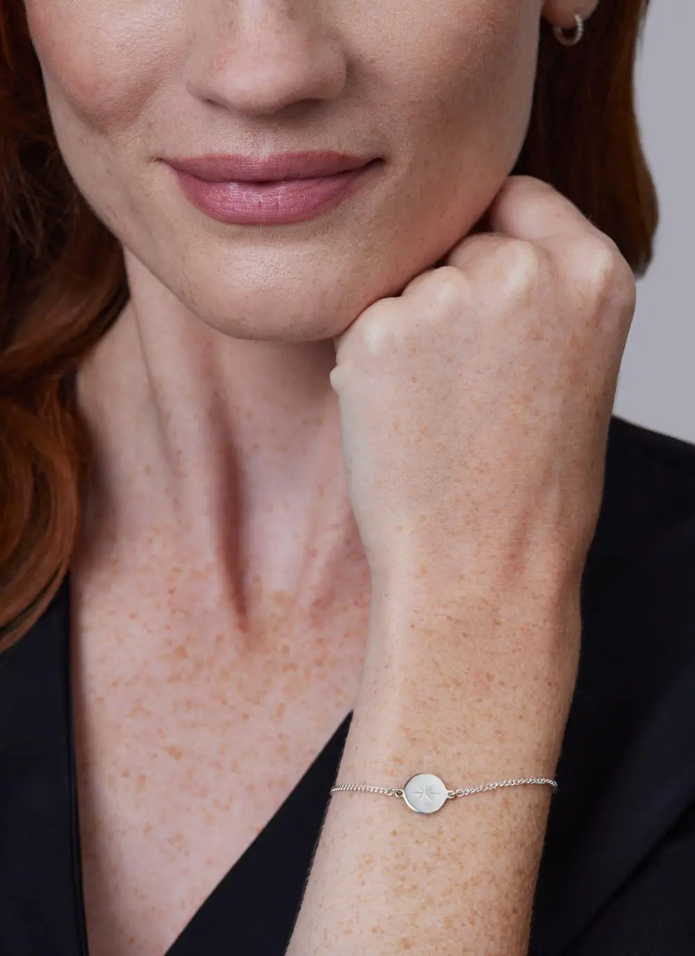 Close up shot of red haired model wearing Sterling Silver Light My Way Diamond Bracelet
