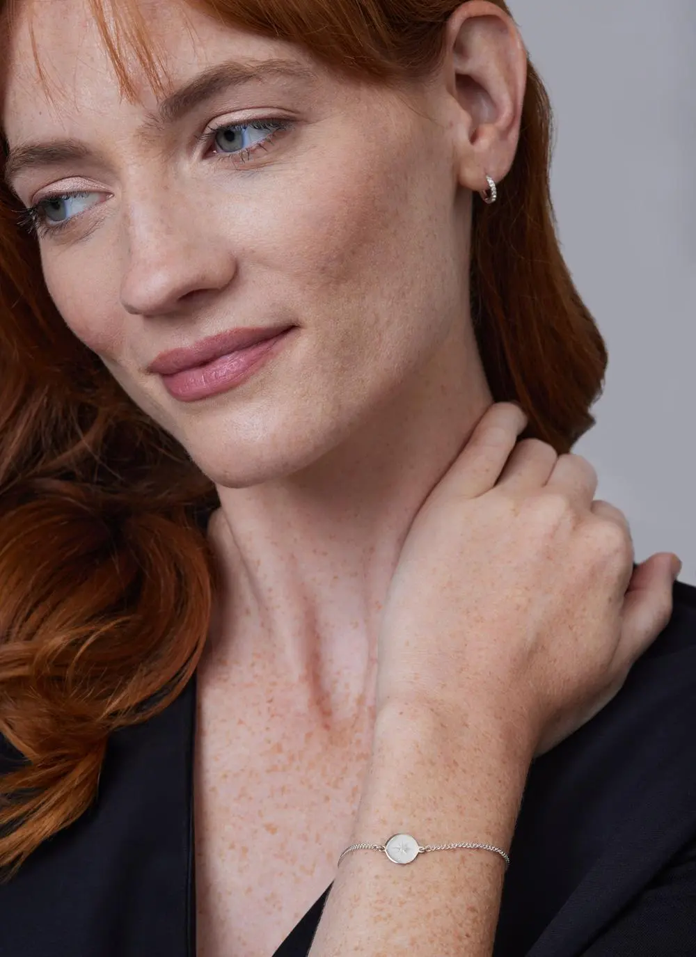 Red haired model wearing Sterling Silver Light My Way Diamond Bracelet