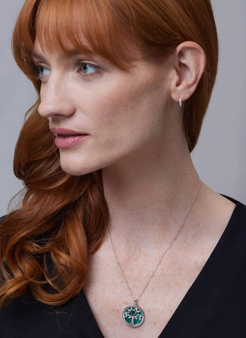Red haired model wearing Sterling Silver Malachite Tree of Life Disc Pendant