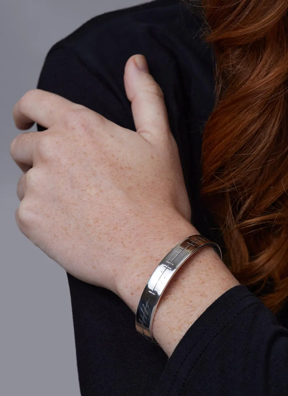 Close up shot of Sterling Silver Ogham Love Forever Bangle