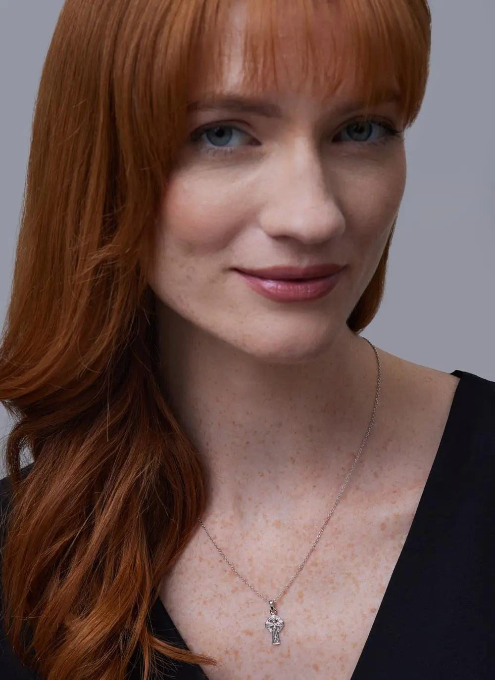 Red haired model wearing Sterling Silver Small Celtic Cross Pendant