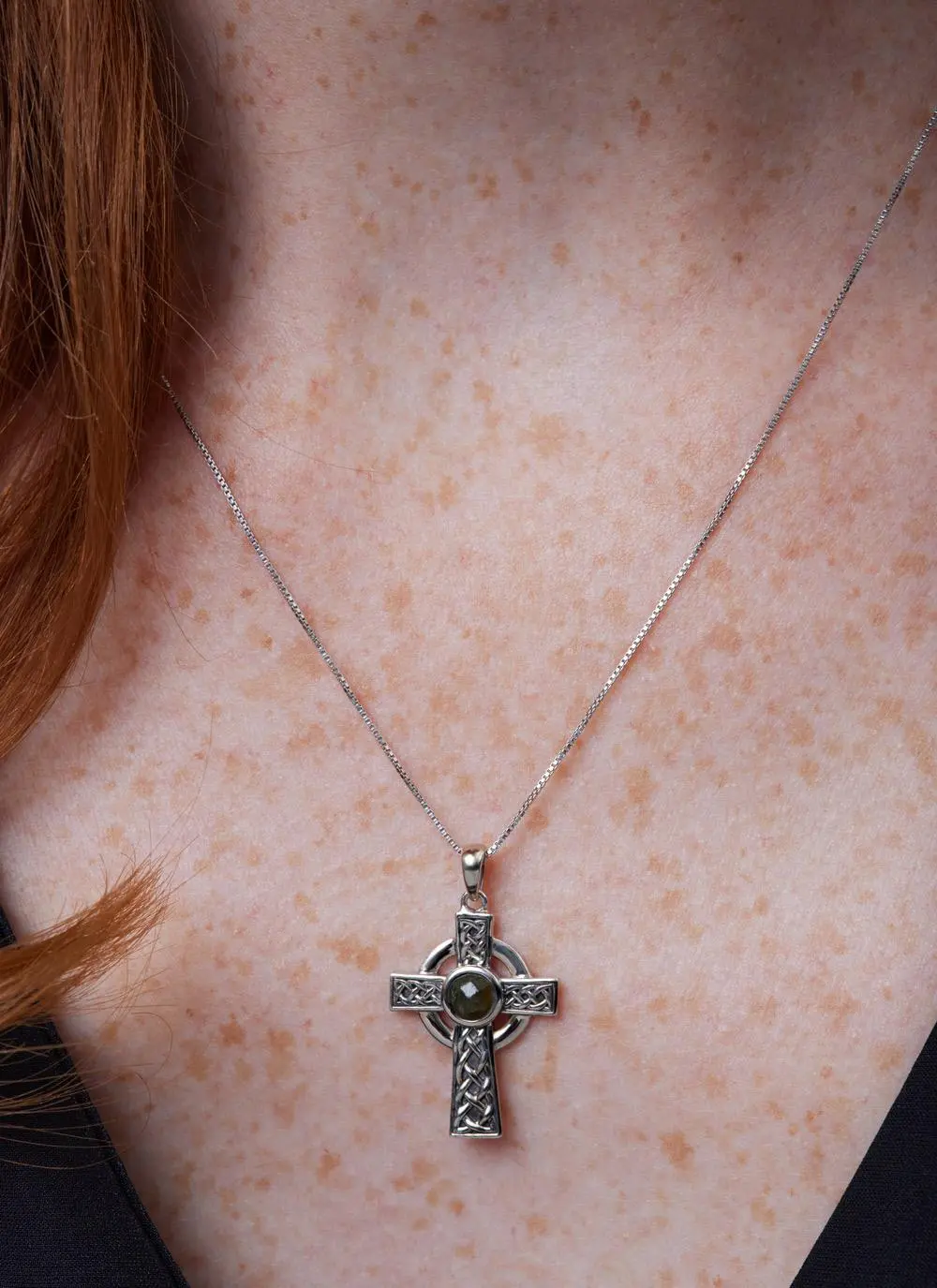 Decolletage shot of Sterling Silver Small Connemara Celtic Cross Pendant