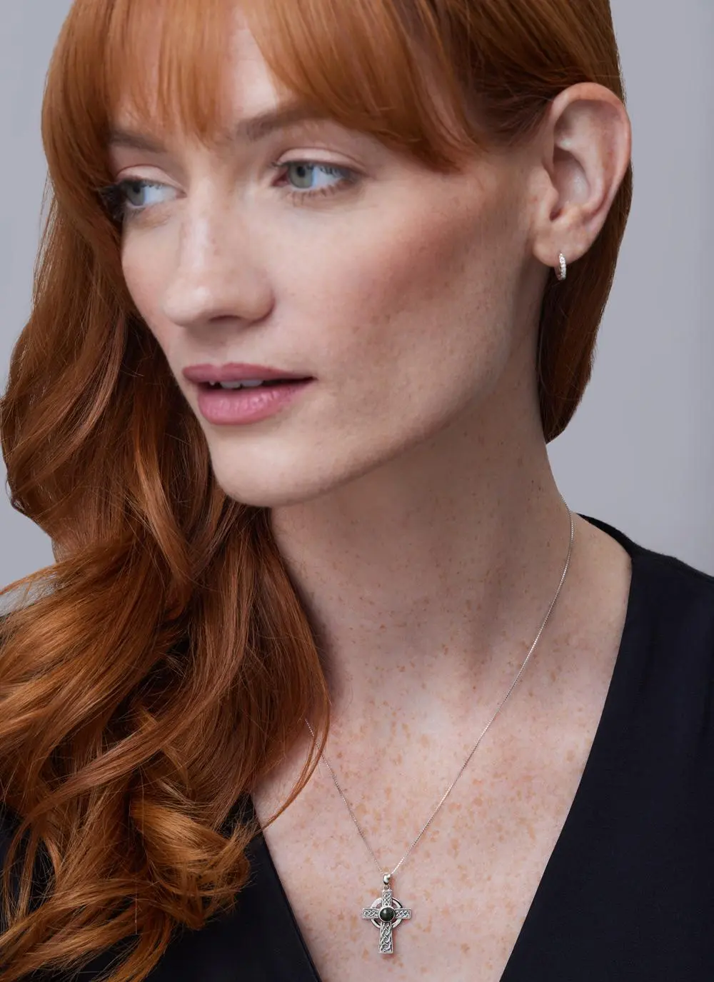 Red haired model wearing Sterling Silver Small Connemara Celtic Cross Pendant