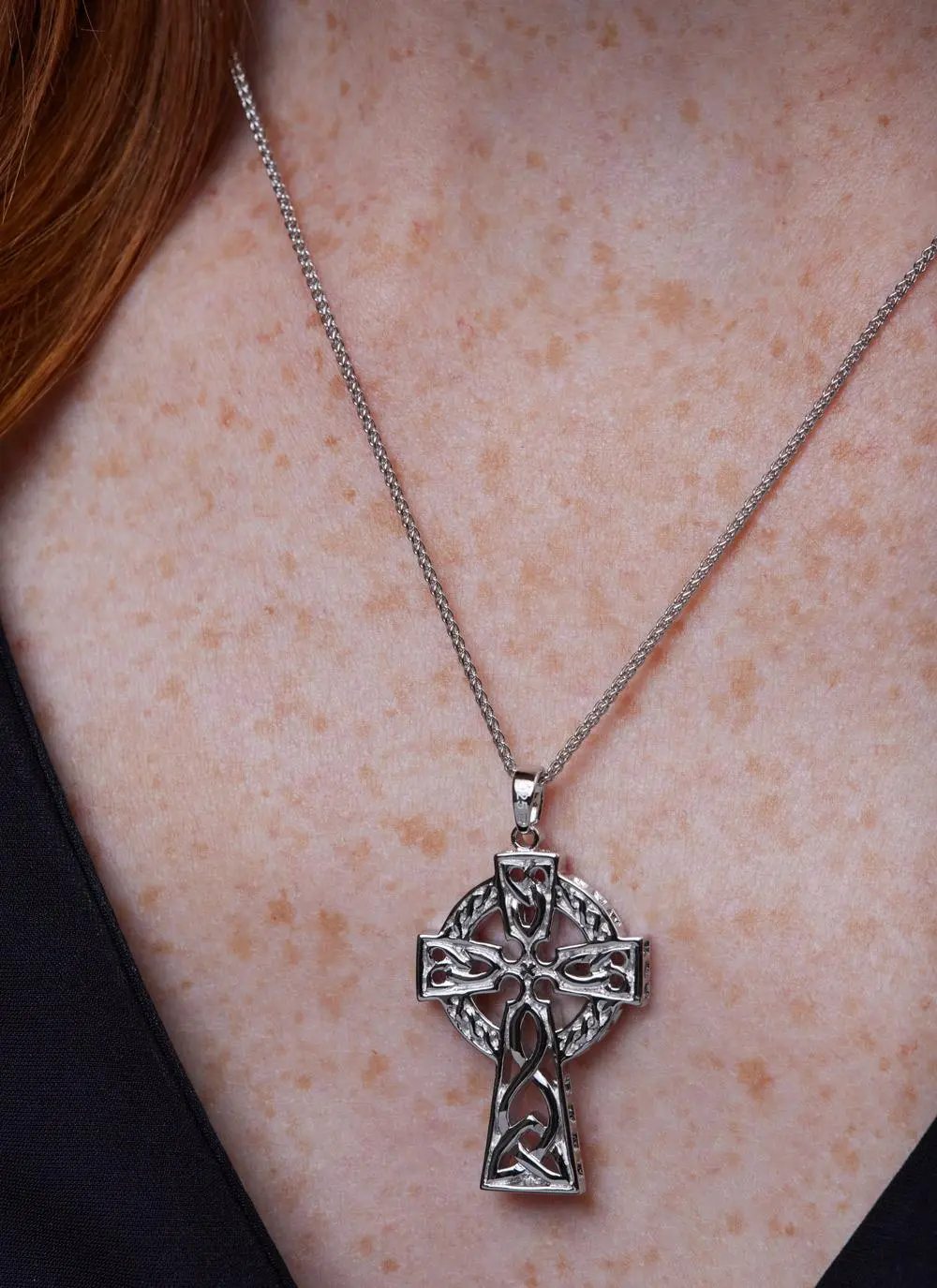 Décolletage shot of  Sterling Silver Traditional Large Celtic Cross Pendant