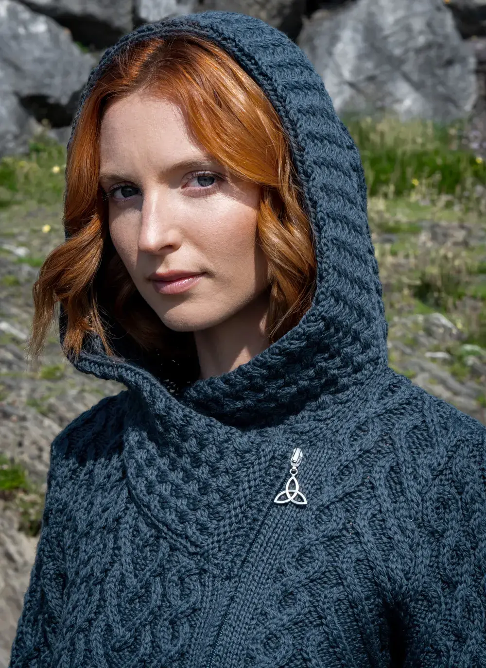 Close up of red headed model hood detail blue aran biker hoodie