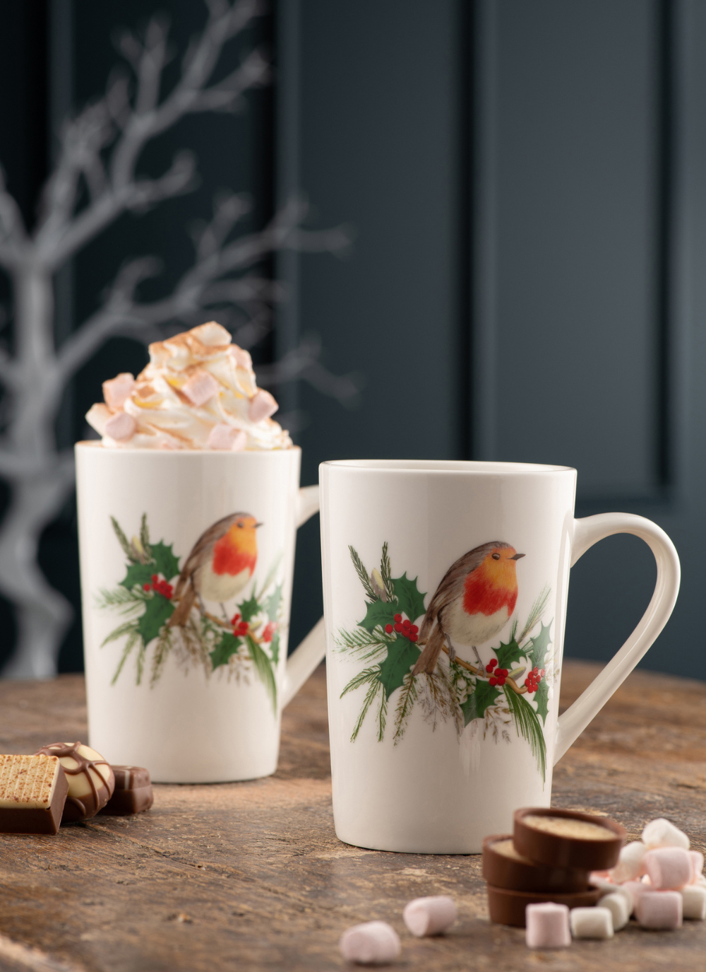 Set of 2 white mugs with a robin on top of holly printed on them