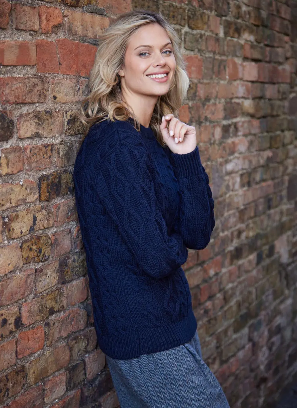 Dark navy ladies aran sweater on blonde model 