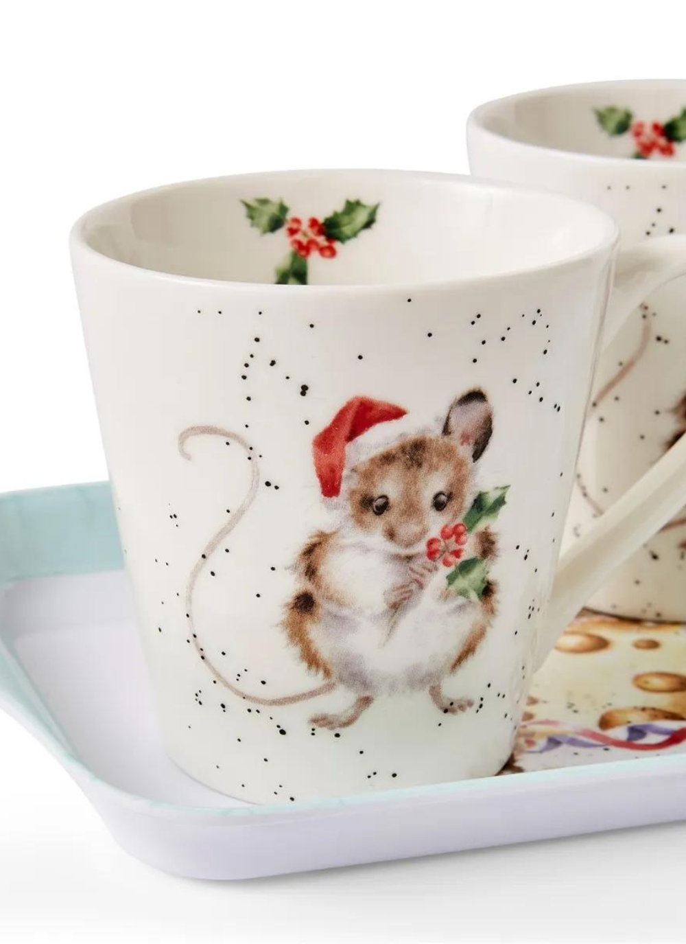 mug depicting a mouse holding holly