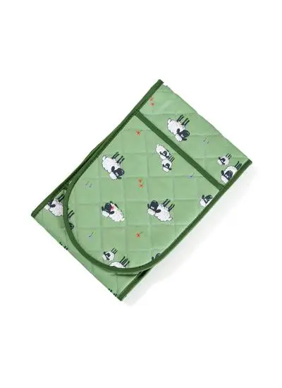 green oven glove with sheep motif on white background