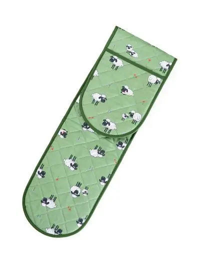 green oven glove with sheep motif on white background