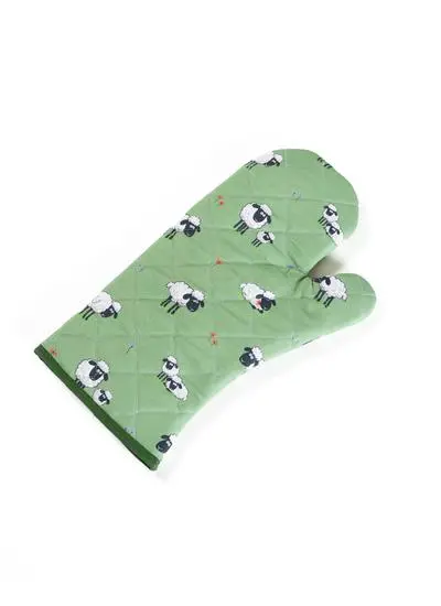 green gauntlet with sheep motif on white background