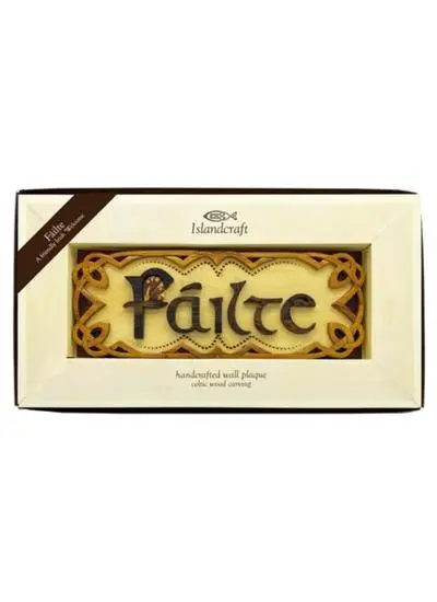wooden plaque with carving in packaging