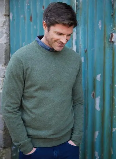 man wearing men's lightweight green crew neck lambswool sweater