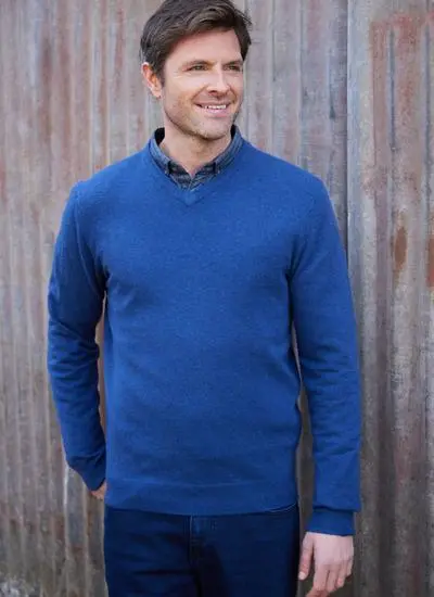 man wearing a blue lightweight lambswool v-neck sweater