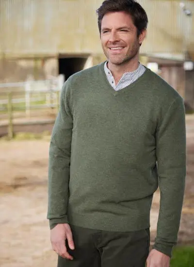 man wearing a green lightweight lambswool v-neck sweater
