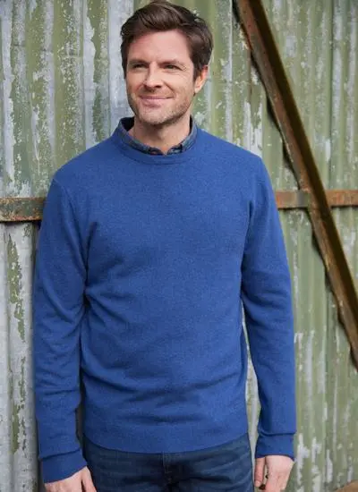 man wearing blue lightweight lambswool crew neck sweater