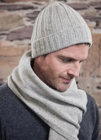 man wearing beige cashmere matching hat and scarf set